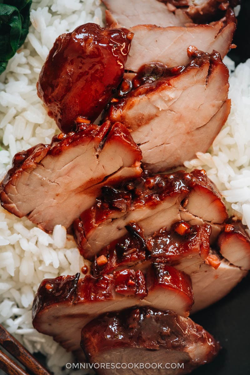 Char Siu (Chinese BBQ Pork, 叉烧肉) - The only char siu recipe you need to make juicy flavorful pork with a sweet glossy glaze, just like you’d get at a Cantonese restaurant. {Gluten-Free adaptable} Char siu pork served on steamed rice close-up