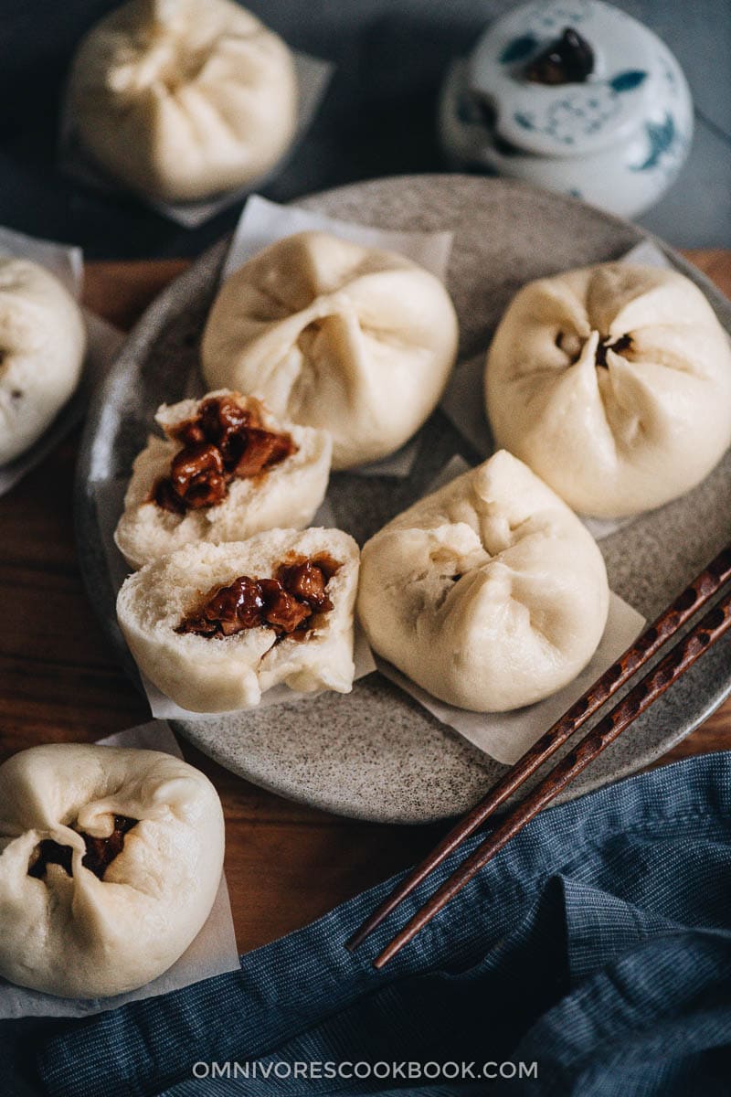 Char Siu Bao (Steamed BBQ Pork Buns) | Learn how to make authentic Chinese char siu bao just like a dim sum restaurant. The buns have very soft, fine, and fluffy bread with a juicy tender pork filling. My recipe includes detailed step-by-step photos and a video to help you achieve the best result in your own kitchen. Steamed bbq pork buns
